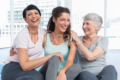 Cheerful fit women in yoga class