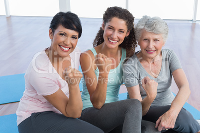 Portrait of happy women in yoga class