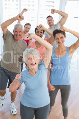 Portrait of smiling people doing power fitness exercise