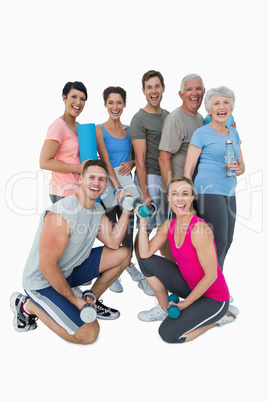 Full length portrait of happy fitness class