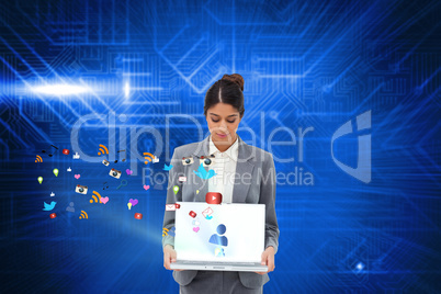 Businesswoman showing laptop with app icons