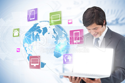 Businessman showing laptop with app icons