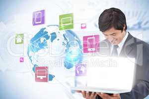 Businessman showing laptop with app icons