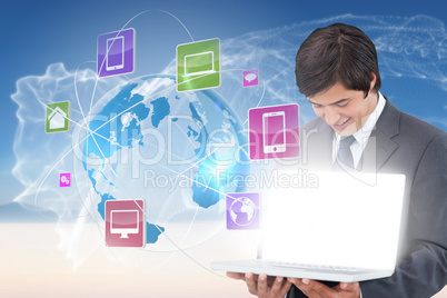 Businessman showing laptop with app icons