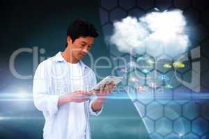 Casual man using tablet with app icons and cloud