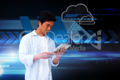Casual man using tablet with cloud graphic