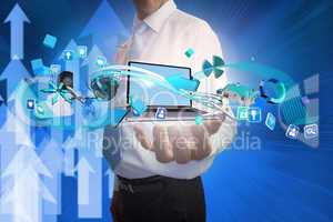Businessman presenting app icons and laptop