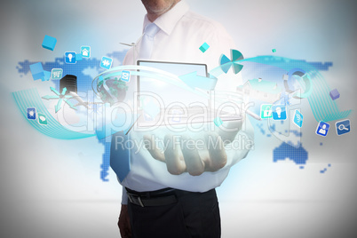 Businessman presenting app icons and laptop