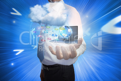 Businessman presenting app icons and laptop with cloud