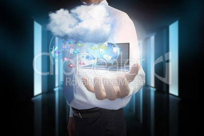 Businessman presenting app icons and laptop with cloud