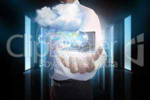 Businessman presenting app icons and laptop with cloud
