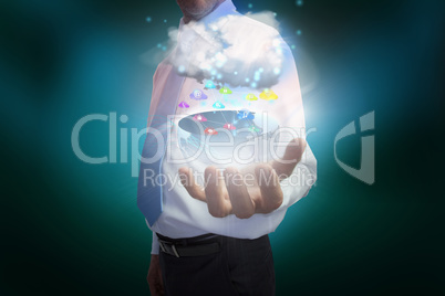 Businessman presenting earth with cloud and app icons