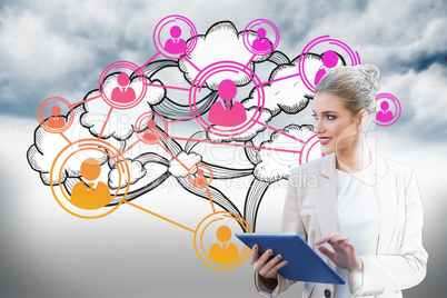 Blonde businesswoman using tablet pc with cloud computing graphi