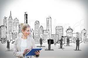 Blonde businesswoman using tablet pc with cityscape