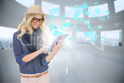 Stylish blonde using tablet pc with email and interfaces