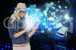 Stylish blonde using tablet pc with interfaces and email icons