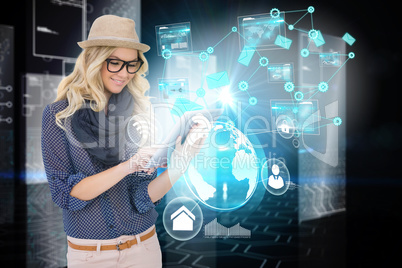 Stylish blonde using tablet pc with interfaces and email icons