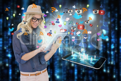 Stylish blonde using tablet pc with app icons and smartphone