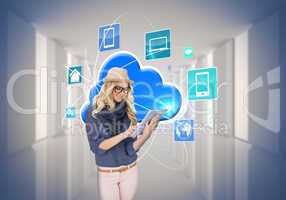 Stylish blonde using tablet pc with app icons and cloud