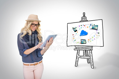 Stylish blonde using tablet pc with app icons and cloud on board