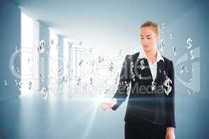 Blonde businesswoman touching dollar signs