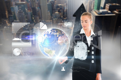 Blonde businesswoman touching earth interface