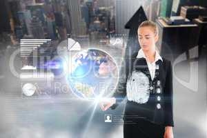 Blonde businesswoman touching earth interface