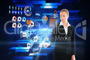 Blonde businesswoman touching interface