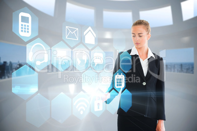 Blonde businesswoman touching app interface