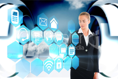 Blonde businesswoman touching app interface