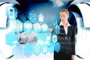 Blonde businesswoman touching app interface