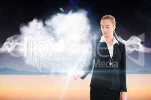 Blonde businesswoman touching light