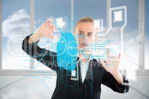 Blonde businesswoman touching interface with fingerprint