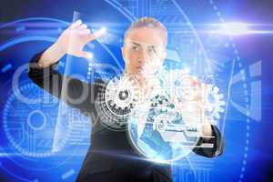 Blonde businesswoman touching interface with earth