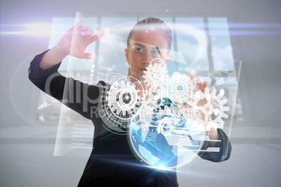 Blonde businesswoman touching interface with earth