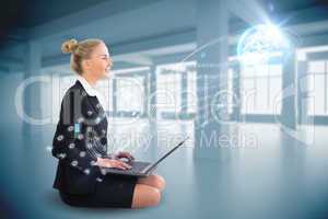 Blonde businesswoman sitting using laptop with interface