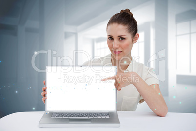 Businesswoman pointing to her laptop