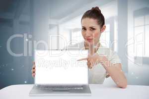 Businesswoman pointing to her laptop