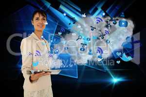 Businesswoman holding tablet with cloud and app icons