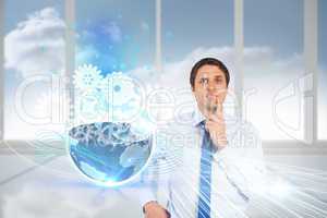 Confused businessman with cogs and wheels graphics