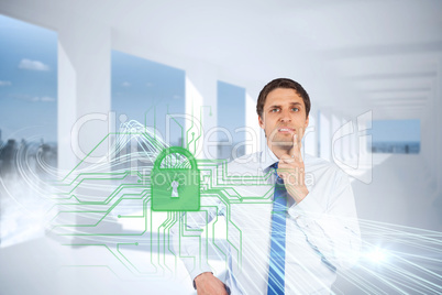 Confused businessman with lock and circuit board graphic