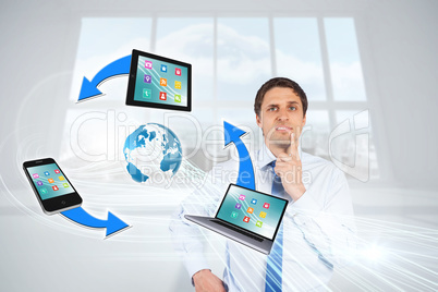 Confused businessman with computer connection graphic