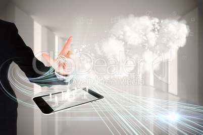 Finger pointing to clouds with tablet pc