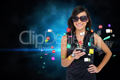 Glamorous brunette using smartphone with app icons