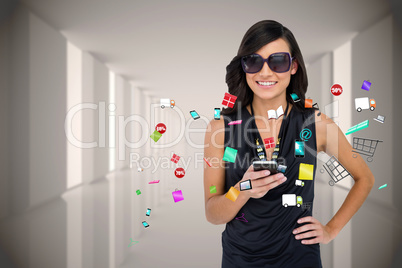 Glamorous brunette using smartphone with app icons