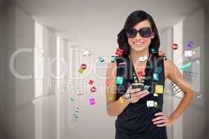Glamorous brunette using smartphone with app icons