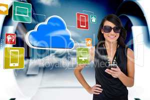Glamorous brunette using smartphone with cloud and icons