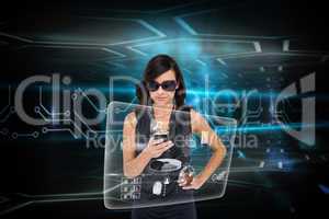 Glamorous brunette using smartphone with interface