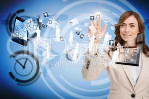 Smiling businesswoman pointing to apps flying between devices