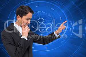 Composite image of thoughtful asian businessman pointing
